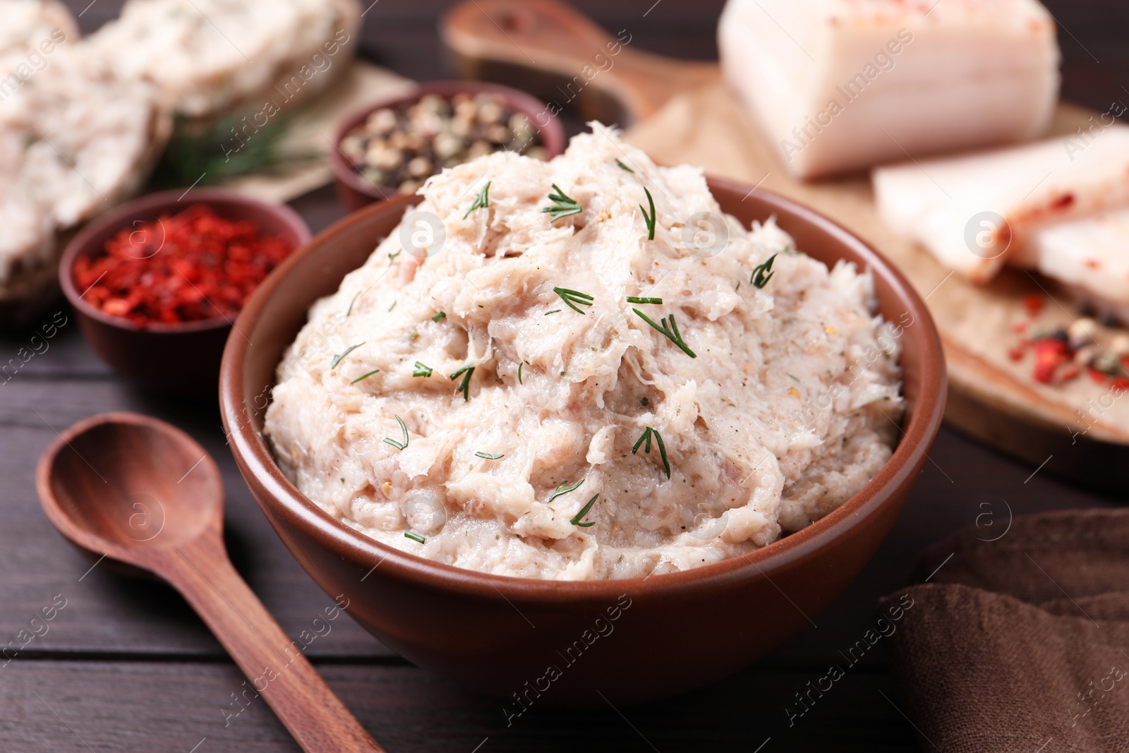 Photo of Delicious lard spread served on wooden table