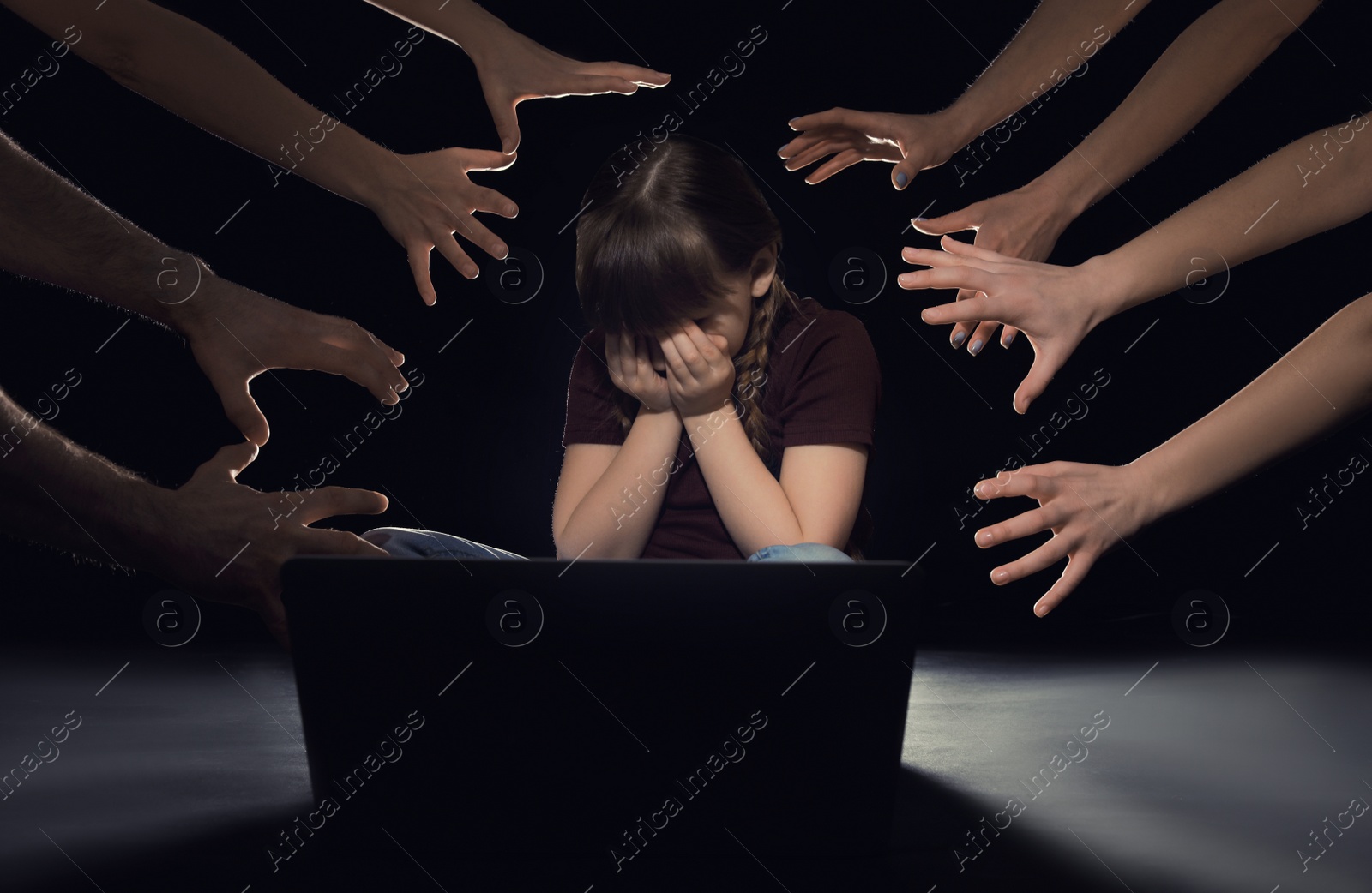 Photo of Strangers reaching frightened little child with laptop on dark background. Cyber danger