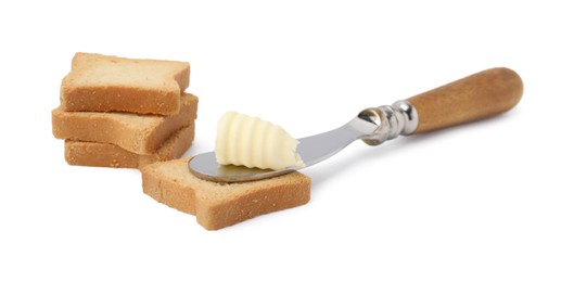 Butter curl, knife and pieces of dry bread isolated on white