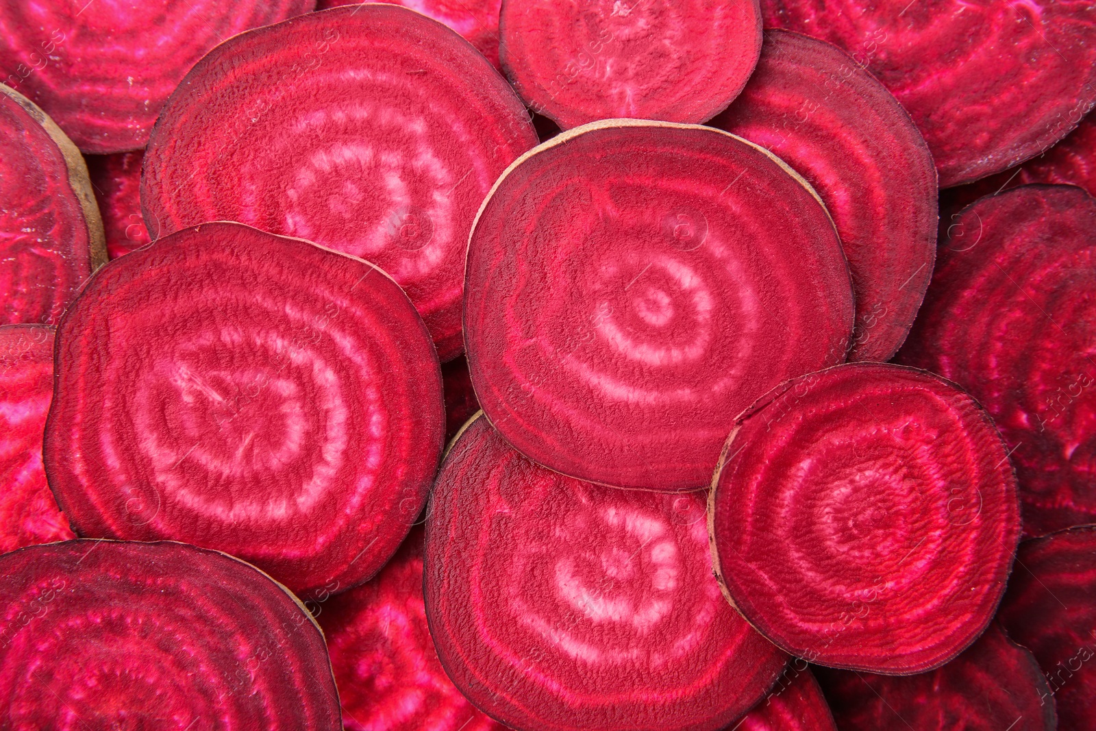 Photo of Sliced red beets as background, top view