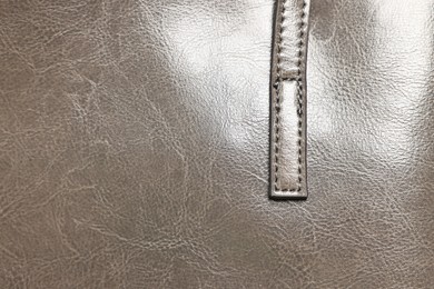 Photo of Natural leather with seams as background, top view