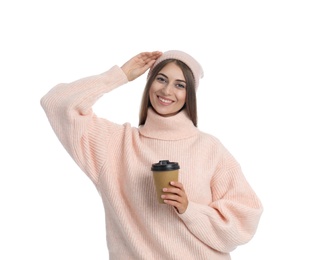 Happy beautiful woman with paper cup of mulled wine on white background