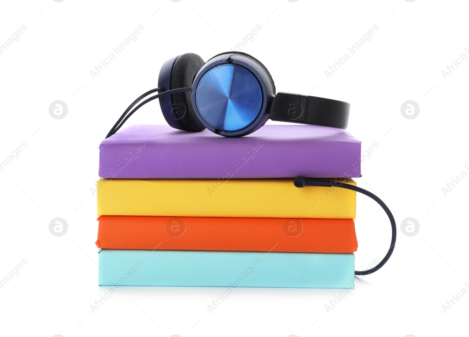 Photo of Modern headphones with hardcover books on white background