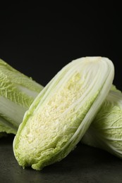 Photo of Fresh ripe Chinese cabbages on grey table