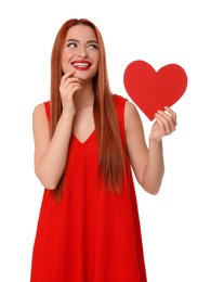 Young woman in red dress with paper heart on white background