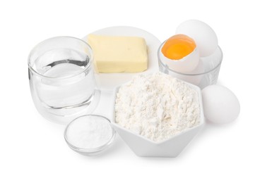 Photo of Eggs, butter, flour, salt and water isolated on white. Ingredients for puff pastry dough