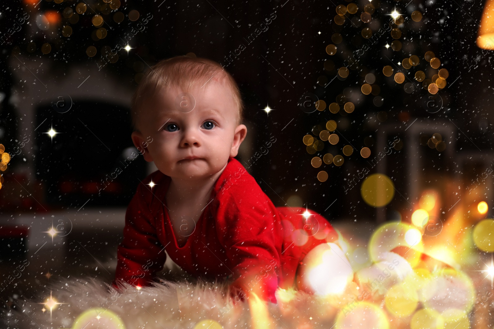 Image of Cute little baby wearing red bodysuit on floor at home. Christmas celebration