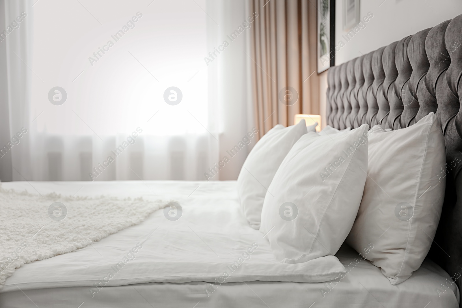 Photo of Bed with pillows in hotel room
