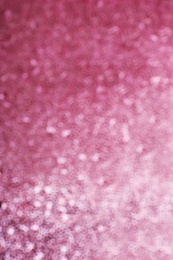 Blurred view of shiny rose gold surface as background