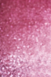 Photo of Blurred view of shiny rose gold surface as background