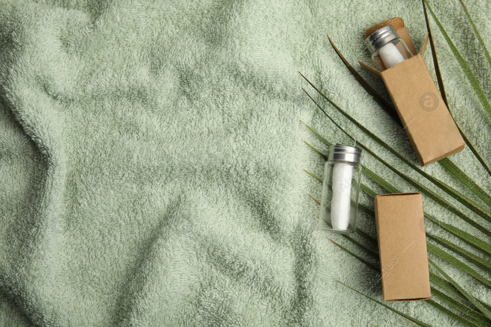 Photo of Flat lay composition with natural dental floss on towel. Space for text