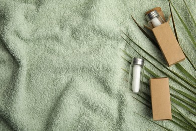 Photo of Flat lay composition with natural dental floss on towel. Space for text