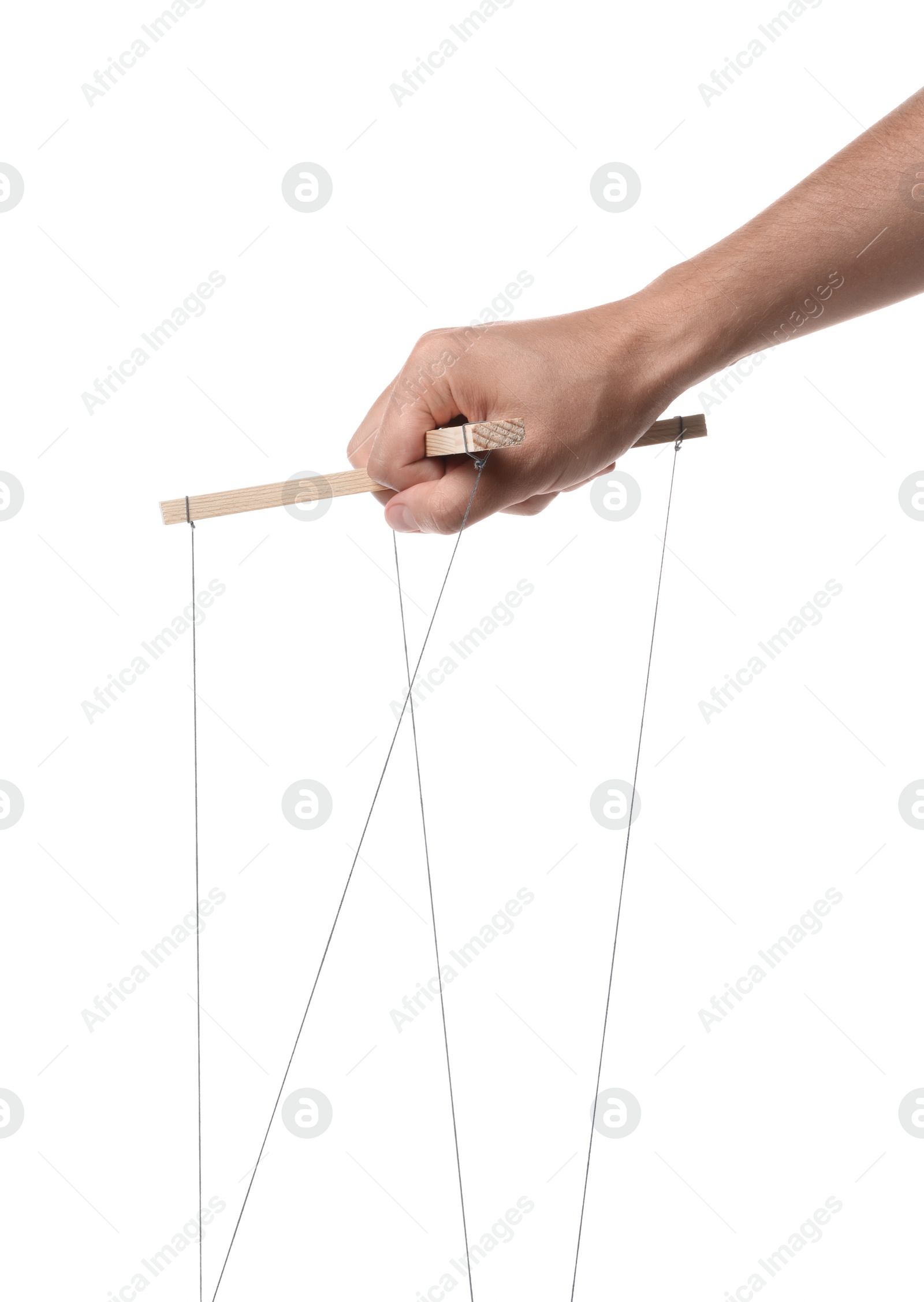 Photo of Man holding puppet control bar with strings on white background, closeup