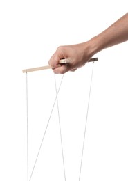 Man holding puppet control bar with strings on white background, closeup