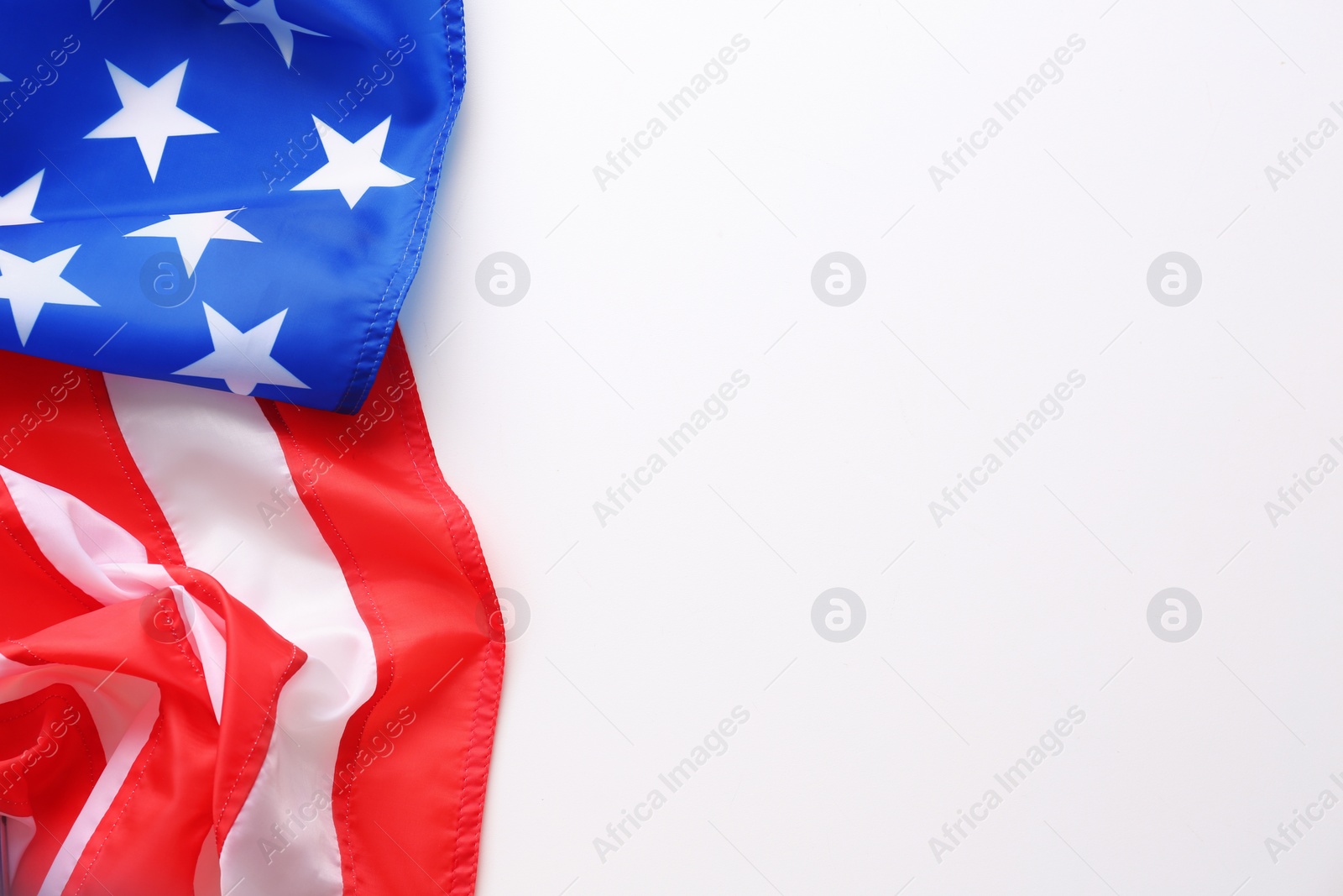 Photo of American flag on white background, closeup. National symbol