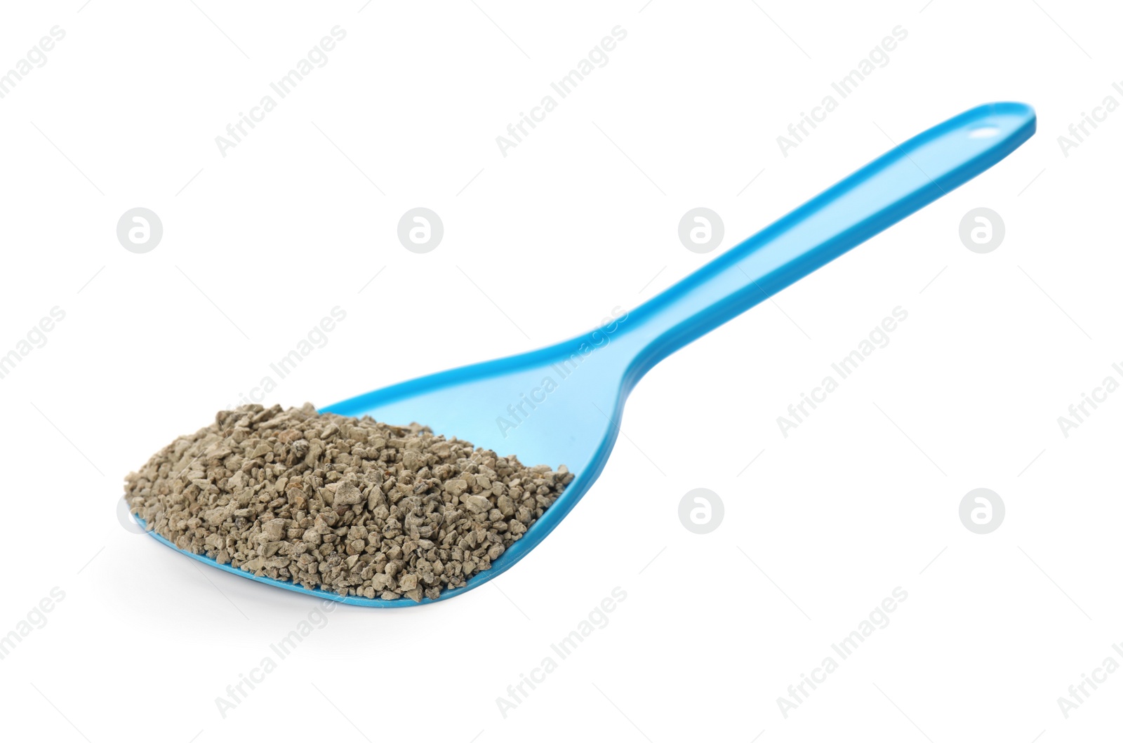 Photo of Light blue plastic scoop with cat litter isolated on white