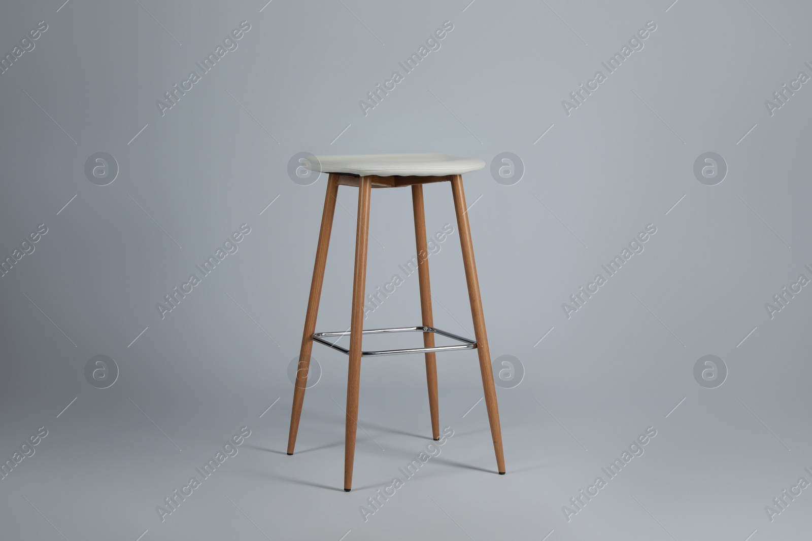 Photo of Stylish bar stool on light grey background. Interior element