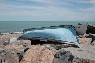 Light blue boat near sea on sunny day