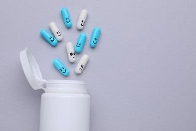 Antidepressants and medical bottle on grey background, flat lay. Space for text
