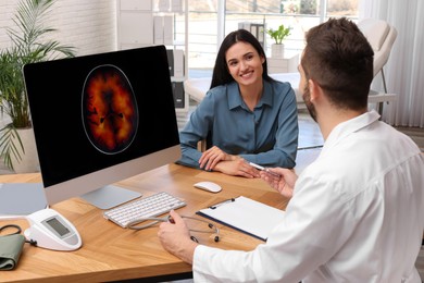 Young woman having appointment with neurologist in clinic