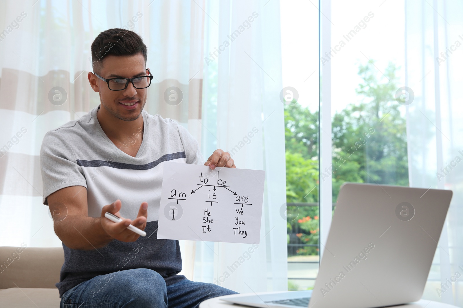 Photo of Teacher giving online lesson during quarantine. Studying at home