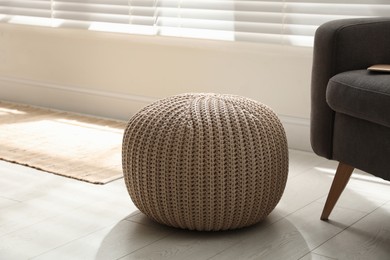 Stylish comfortable pouf in room. Home design