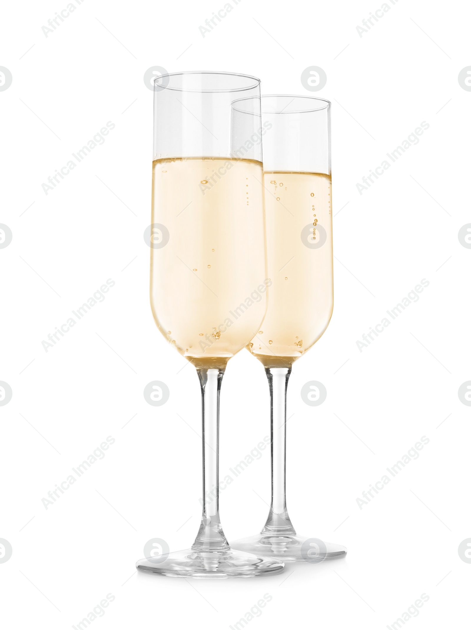 Photo of Glasses of sparkling wine on white background