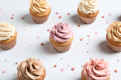 Photo of Delicious birthday cupcakes on white background, closeup