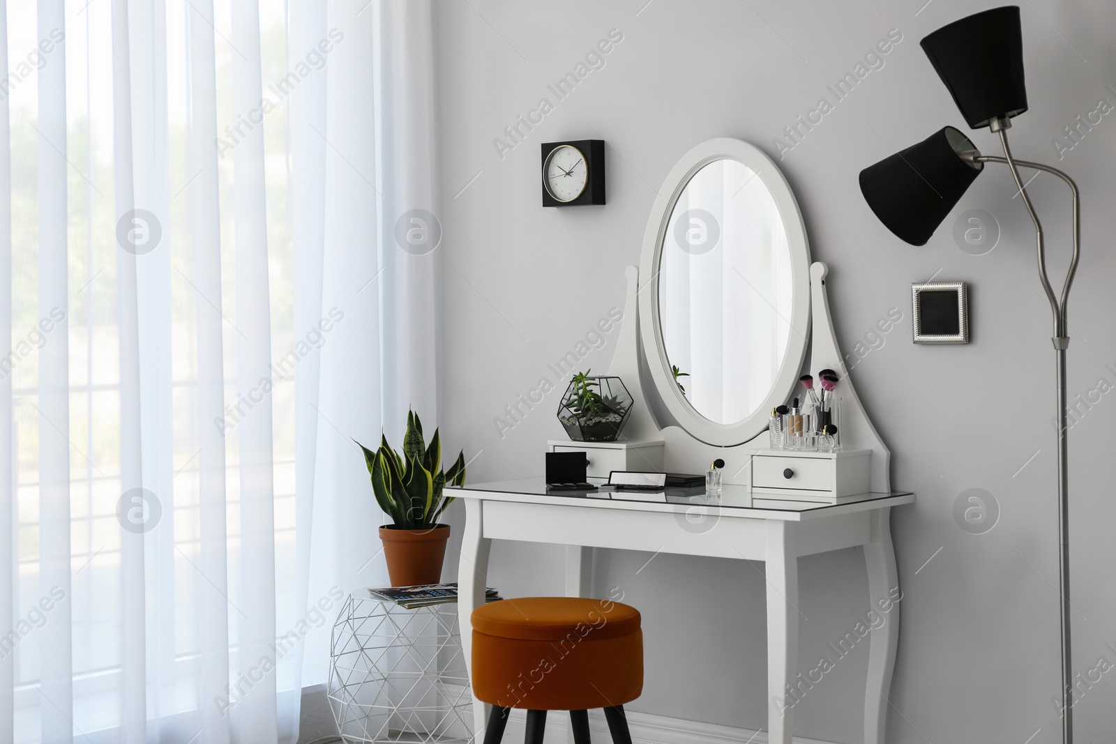 Photo of Dressing table with mirror in stylish room interior