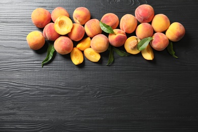 Photo of Flat lay composition with ripe peaches on wooden background