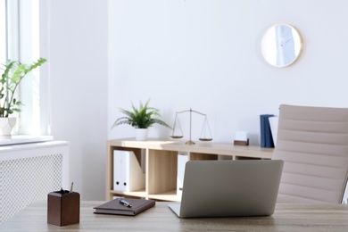 Photo of Lawyer's workplace with laptop in office