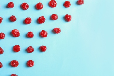 Photo of Flat lay composition of cherries on color background, space for text. Dried fruit as healthy snack