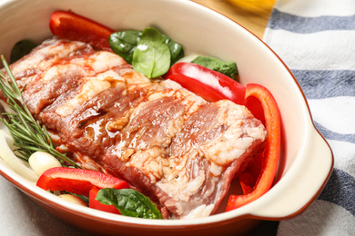 Photo of Raw spare ribs with garnish, closeup view