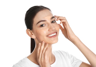 Photo of Happy young woman with organic mask on her face against white background