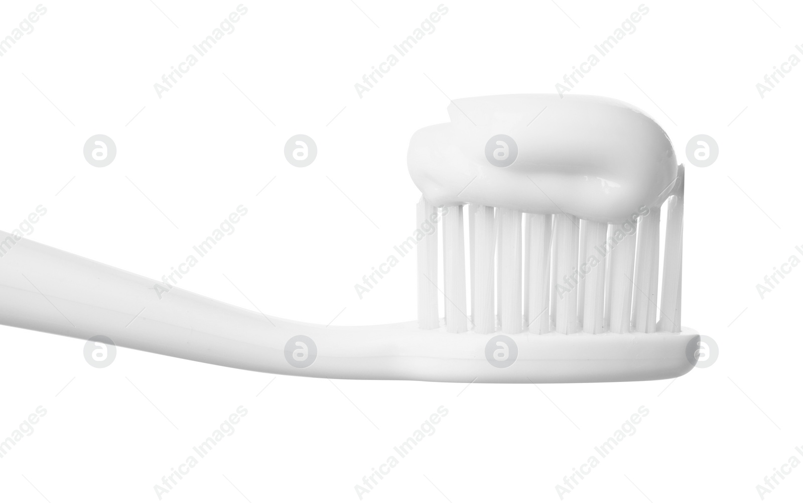 Photo of Plastic toothbrush with paste on white background, closeup