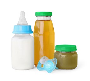 Healthy baby food, bottles with milk, juice and pacifier on light grey background