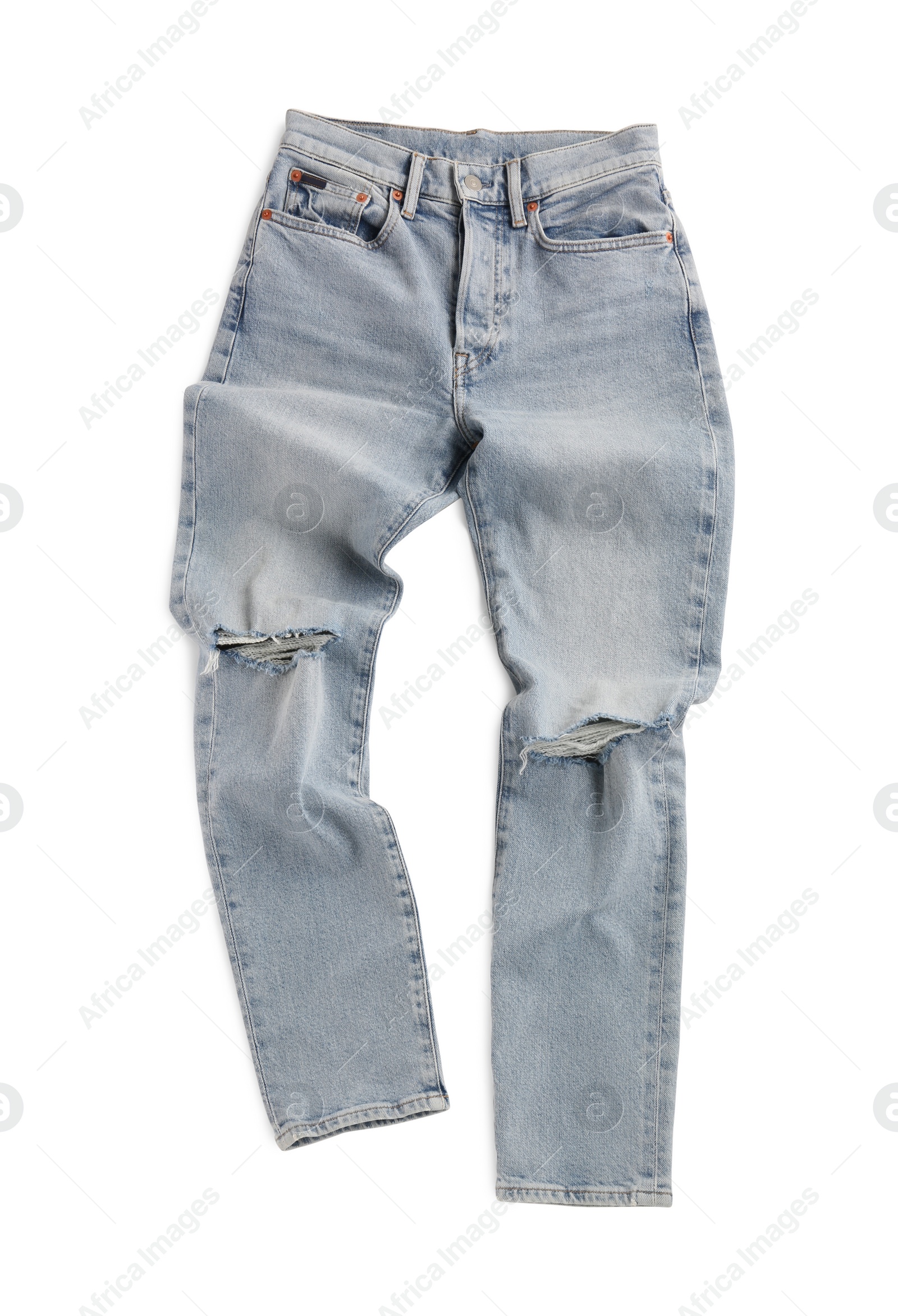 Photo of Rumpled light blue jeans isolated on white, top view. Stylish clothes