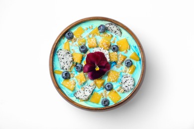 Photo of Delicious smoothie bowl with fresh fruits, blueberries, flower and oatmeal on white background, top view