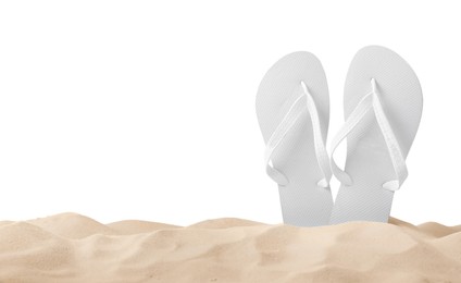 Bright flip flops in sand on white background