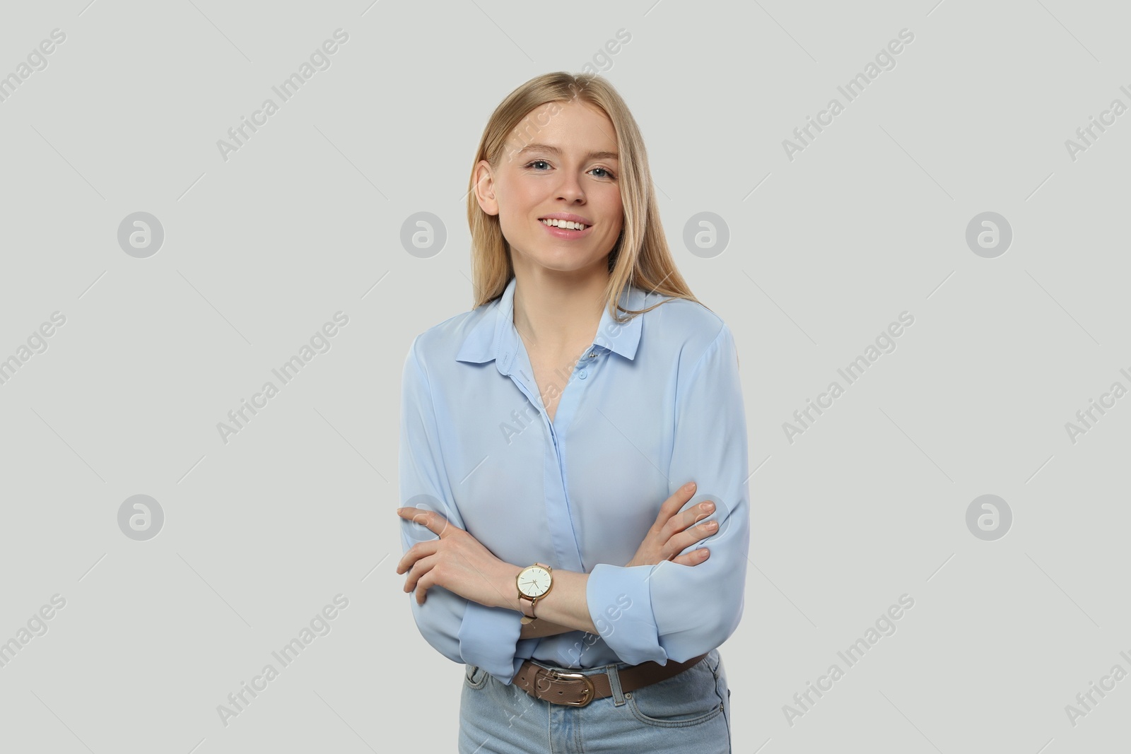 Photo of Portrait of beautiful young woman in stylish blouse on white background