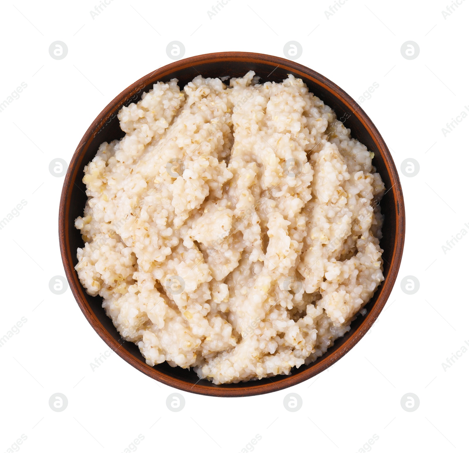 Photo of Delicious barley porridge in bowl isolated on white, top view