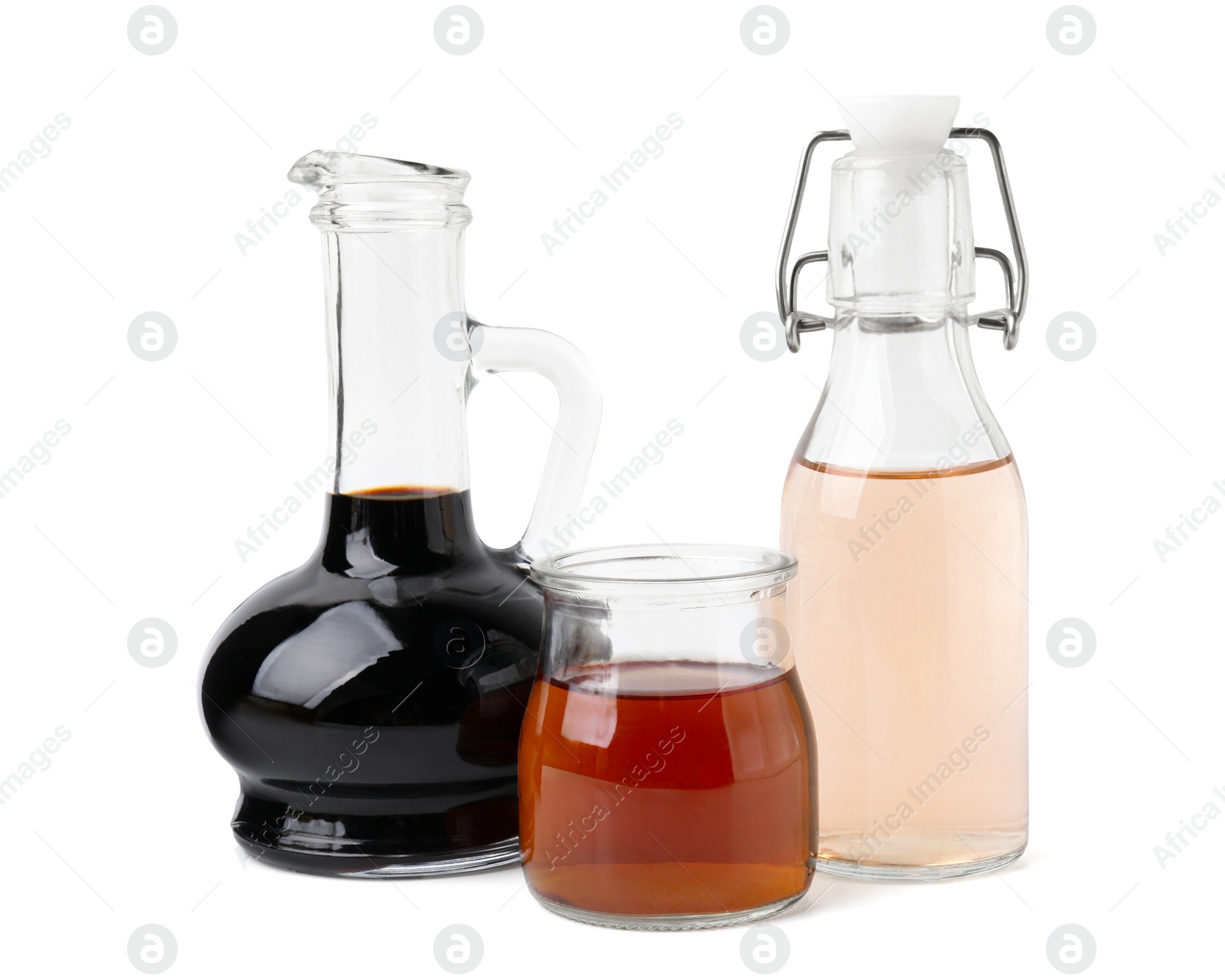 Photo of Different types of vinegar isolated on white