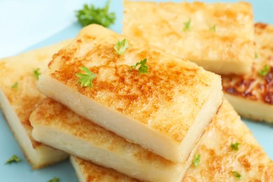 Photo of Delicious turnip cake with parsley on plate, closeup