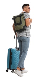 Man with backpack and suitcase on white background, back view. Summer travel