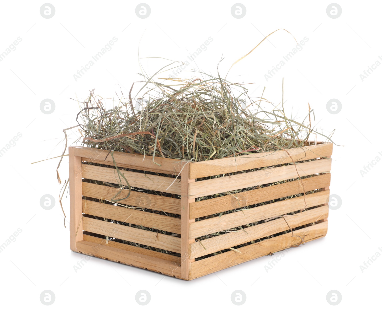 Photo of Dried hay in wooden crate isolated on white