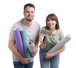 Photo of Couple with wallpaper rolls and brush on white background