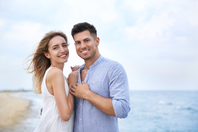 Photo of Happy couple on beach, space for text. Romantic walk