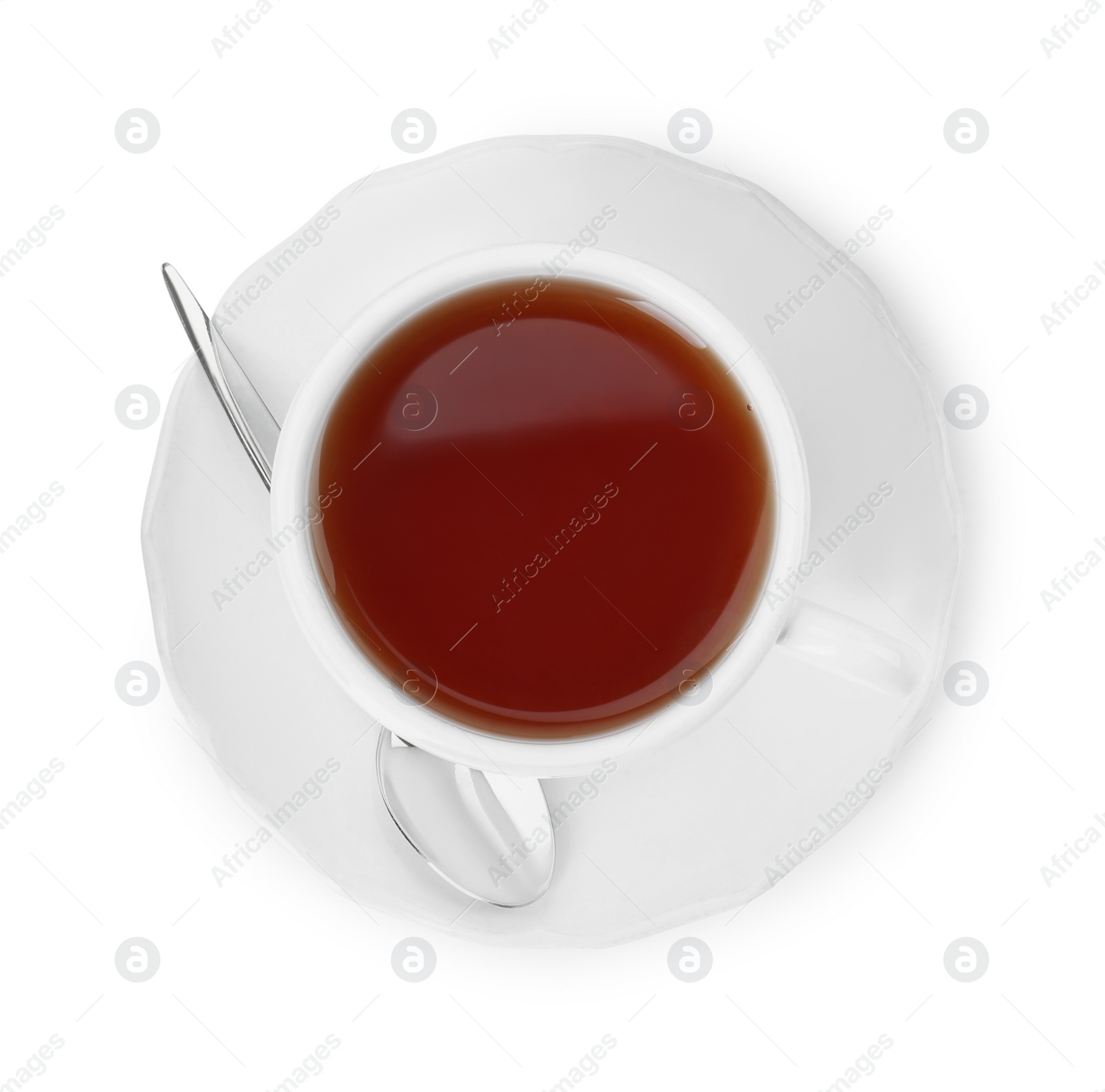 Photo of Aromatic tea in cup and spoon isolated on white, top view