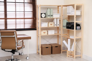 Modern home workplace with wooden storage. Idea for interior design