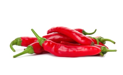 Photo of Heap of red chili peppers on white background